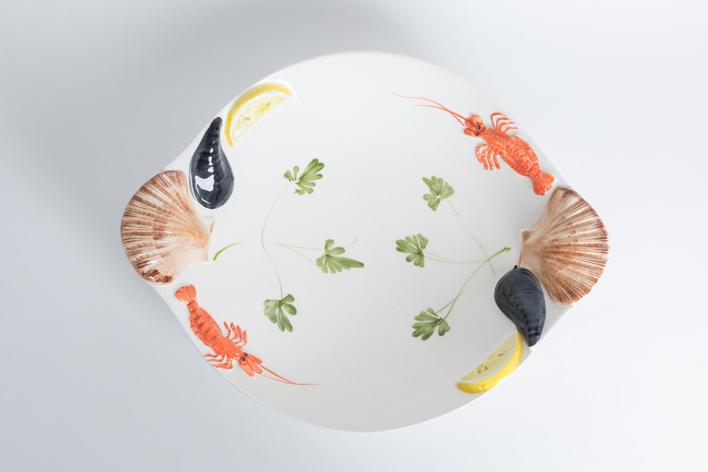 Piatto pesce e conchiglie profondo
